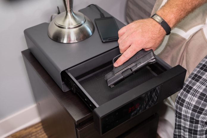 hornady-1410996600-98215-Rapid-Safe-Night-Guard-retrieving-gun-copy-scaled.jpg