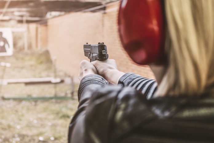 bigstock-Shooting-With-Gun-244881502.jpg